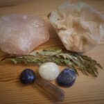 Crystal bundle with rose quartz, zeolite, lemon quarts, sodalite, lapis lazuli, and smokey quarts. Set up with dried thistle leaf.